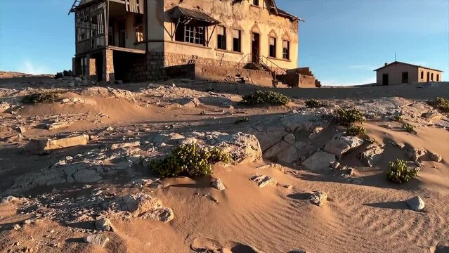 An abandoned ruin of a house stands in Kolmannskuppe in the Namib desert of Southern Africa