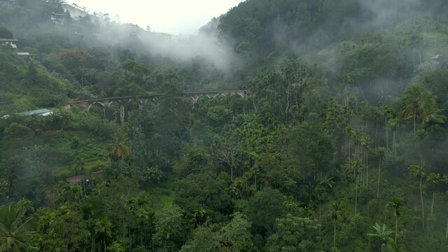 Distant Rising Establishing Aerial Drone Shot of Nine Arches Bridge on Misty Morning in Ella Sri Lanka
