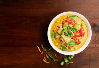 Chicken green curry Asian food, Beef green curry Thai food on a soup bowl with a mixture of herbs, vegetables and Thai red chilli spices. Top view.