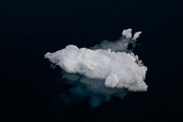 Melting sea ice, broken off from the ice shelf, floating in the arctic ocean in the high arctic, global warming in action  © knelson20