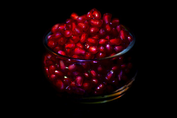 pomegranate seeds in a glass bowl