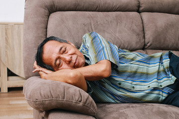 Portrait of a senior man resting in a couch