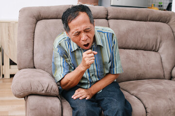 Old asian man get a cold and cough at home - obrazy, fototapety, plakaty