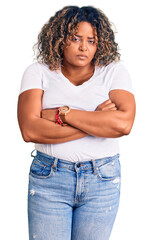 Young african american plus size woman wearing casual clothes skeptic and nervous, disapproving...