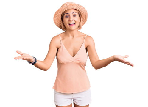 Young blonde woman wearing summer hat smiling cheerful offering hands giving assistance and acceptance. - Powered by Adobe