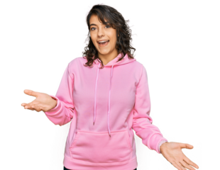 Young hispanic woman wearing casual sweatshirt smiling cheerful with open arms as friendly welcome, positive and confident greetings