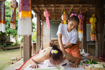 Massage and spa relaxing treatment of office syndrome traditional thai massage style. Asain female masseuse doing massage and skin scrub treat back pain, arm pain and stress for good skin and health. - obrazy, fototapety, plakaty