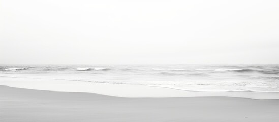Minimalistic black and white photography of sandy beach perspective. - obrazy, fototapety, plakaty