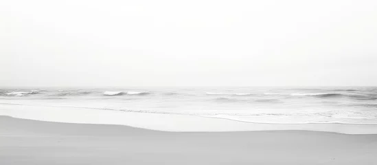 Fotobehang Minimalistic black and white photography of sandy beach perspective. © AkuAku