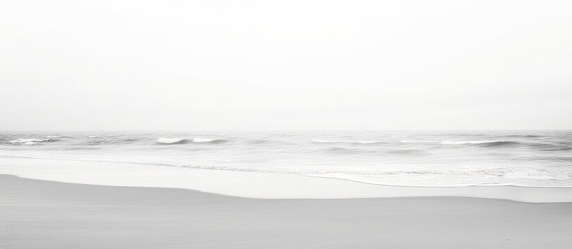 Fototapeta Minimalistic black and white photography of sandy beach perspective.