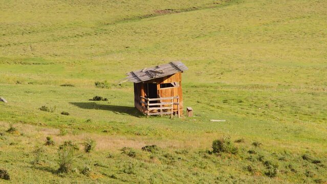 Scenic view of a rustic cabin in the meadows in Phobjikha valley in Bhutan, scenic nature in Asia.