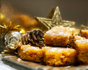 Carrot cake decorated with stars and Christmas ornaments.Short plane