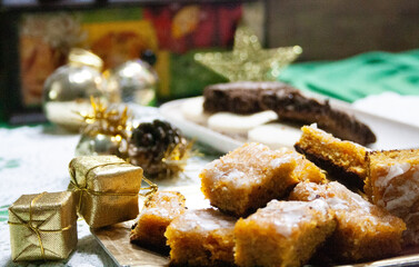 Carrot cake and cookies on Christmas table. 