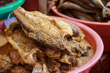 Khmer fermented fish called prahok and pa ok in different stage of fermentation sold on the local...