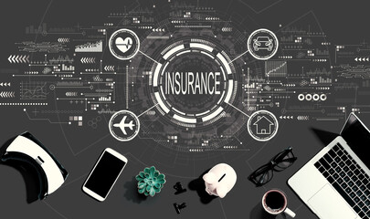 Insurance concept with electronic gadgets and office supplies - flat lay