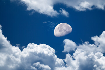 Obraz na płótnie Canvas beautiful background of blue sky with white clouds an a full moon