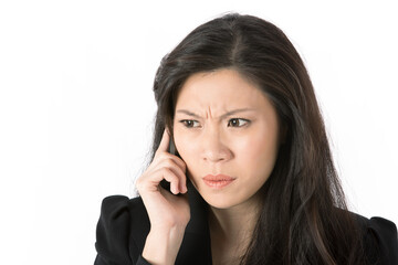 Angry businesswoman talking on smart phone