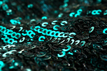 Christmas abstract background made of emerald green sequins.