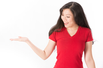 Woman holding out hand to show something.