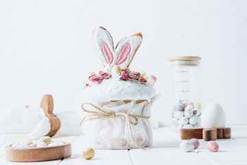 Easter Panettone with bunny ears cookies, mini chocolate eggs, marshmallows and dry roses.