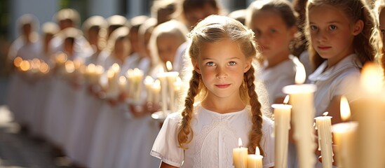Austrian children's sunny day ceremony with candles and white dresses - obrazy, fototapety, plakaty