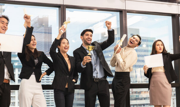 Success business group celebrating after meeting, Businesspeople with certificate in the office - Powered by Adobe