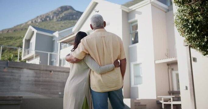 Couple, hug outdoor and new home, real estate or property, investment with homeowners in neighborhood. Back of senior people in backyard, planning retirement and ideas for moving into dream house