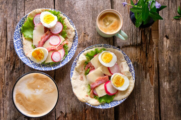 Flatbread with pink salmon, egg, radish, lettuce