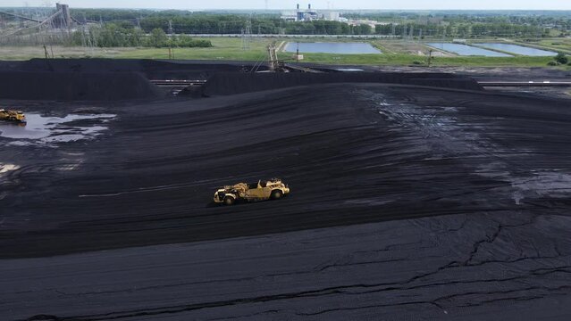 Grader working a pile of coal for the DTE Belle River Power Plant, aerial view