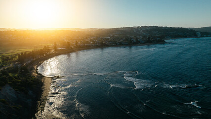 Late afternoon sunshine over a coastal suburb in Sydney's northern beaches.