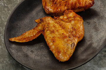 Tasty roasted chicken wing with spices