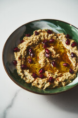 Baba ganoush. A smoky Middle Eastern dip made from roasted eggplants, blended with tahini, lemon juice with garlic and olive oil. often garnished with parsley and served with pita bread.