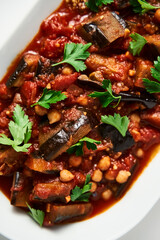 Maghmour or Lebanese moussaka. Dish made from baked or fried eggplant with spices, chickpeas and tomato sauce. Eggplants are stewed in tomato sauce