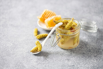 Honey fermented pine flowers in a jar. Alternative natural medicine