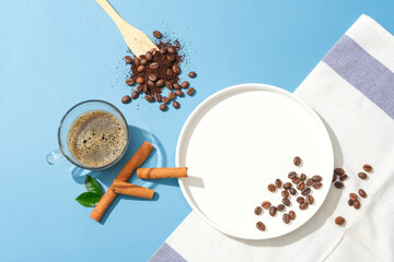 A cup of black coffee, coffee beans, coffee powder, a ceramic plate and towel on a blue background. Caffeine in coffee helps prevent reactions that damage the skin.