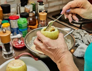 Foto op Canvas Chef's Hands Preparing Round Zucchini Stuffed with Meat in a Modern Kitchen © AlexanderD