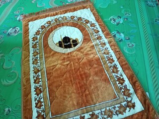 Colorful islamic  praying mat or  carpet with a pattern in the style of Khiva. photo taken in malaysia