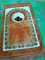 Colorful islamic  praying mat or  carpet with a pattern in the style of Khiva. photo taken in malaysia