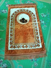 Colorful islamic  praying mat or  carpet with a pattern in the style of Khiva. photo taken in malaysia