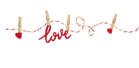 Cotton rope and four pins with hanging hearts and text LOVE isolated on white or transparent background