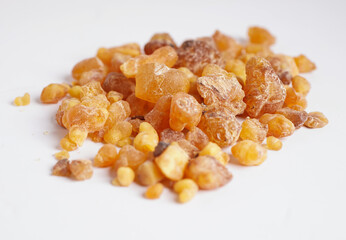 Frankincense or olibanum aromatic resin isolated on white background used in incense and perfumes..