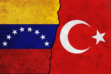 Turkey and Venezuela painted flags on a wall with a crack. Venezuela and Turkey relations.Turkey and Venezuela flags together