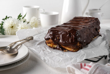 Lviv cheesecake, a traditional Ukrainian dessert with raisins, coated with chocolate icing.