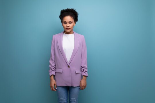 young pretty latin woman dressed in lilac jacket isolated studio background with copy space