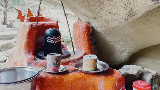Close up shot of shiva linga inside the Mata Mandir in Hingol, Balochistan at daytime.