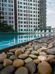 Swimming pool among high rise condo buildings ,Bangkok, Thailand