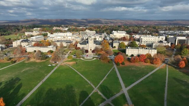 Drillfield lawn at Virginia Tech. High aerial truck shot above large, beautiful campus in autumn.