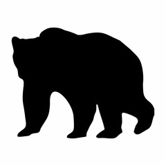 silhouette of a black bear walking