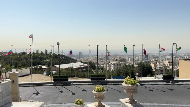 Country flag Iran Saudi Arabia Azerbaijan Russia Italy in Tehran big city mega urban capital in air pollution quality time in a luxury pavilion after trip to middle east asia tourist travel to stay 