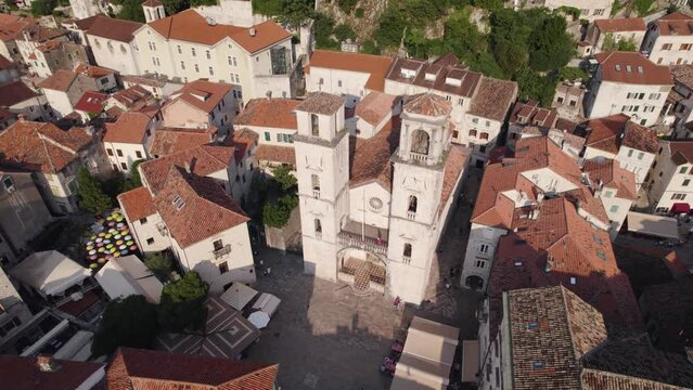 Aerial view of roman catholic Cathedral of Saint Tryphon in Kotor, Montenegro, orbiting